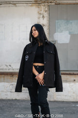 Front view of the black Death the Kid Denim Jacket featuring skull embroidery on a model.