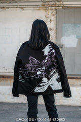 Back view showing the large white Gun Play character embroidery and oversized fit.