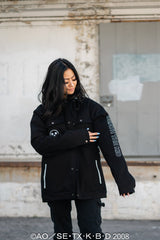 Side profile shot showing the sleeve branding and structured shoulder silhouette.