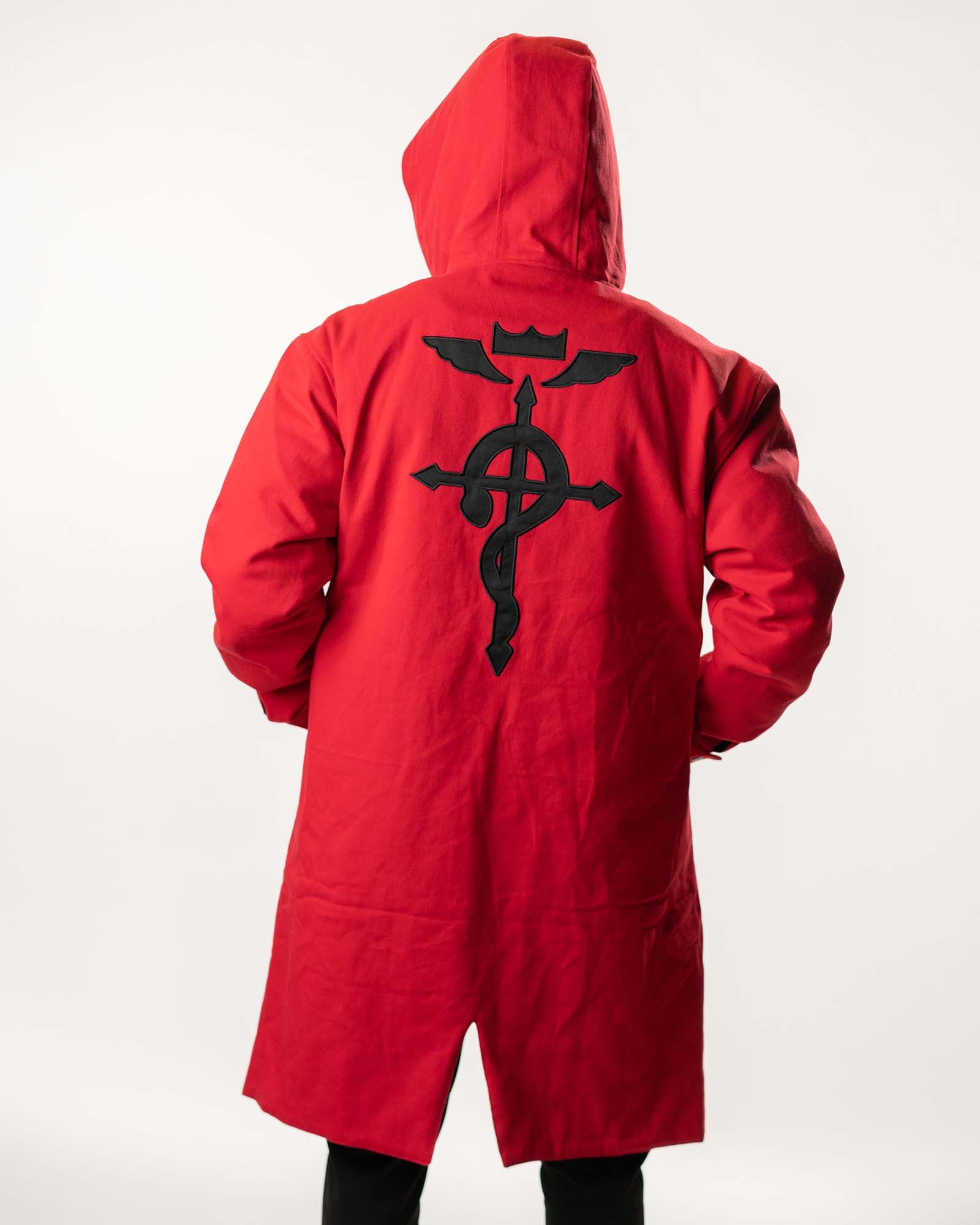 Back view of the red denim trench featuring the large black Flamel symbol.