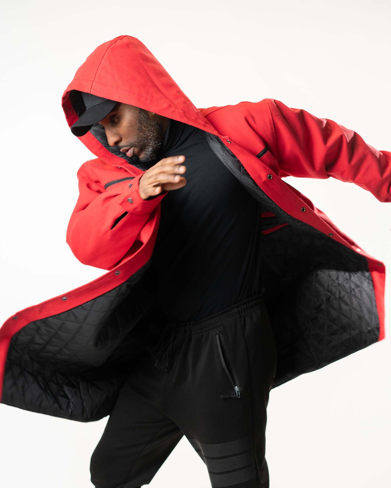 Action shot of the red denim jacket highlighting the movement and oversized fit.