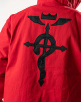 Close-up of the high-density black embroidery on the red denim back.