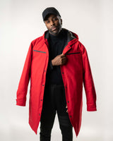 Full-body studio shot of the red long-line denim jacket and black apparel.