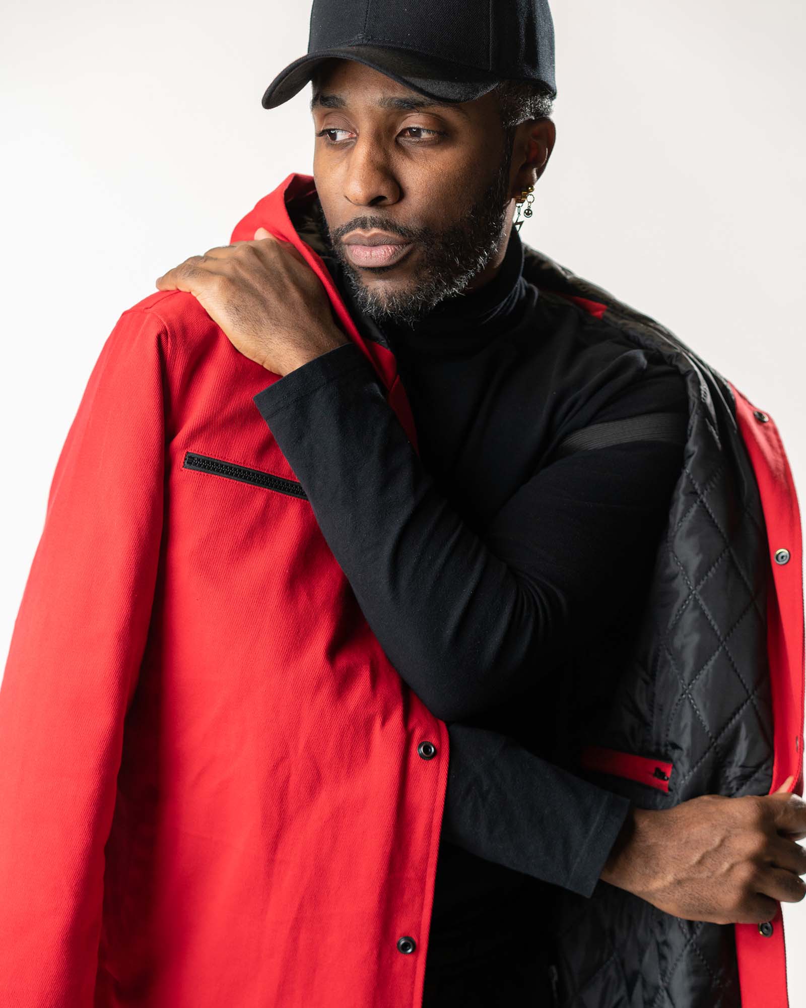 Close-up of the integrated shoulder strap and quilted interior lining detail.