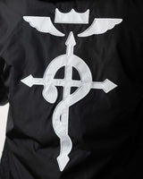 Close-up of the high-contrast Flamel symbol printed on the black water-resistant fabric.