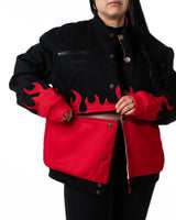 Side view of female model wearing black Gurren Lagann jacket with red panel sleeve detail
