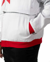 Detailed close-up of the sleeve of the cropped white Gurren Lagann jacket, showing pocket.