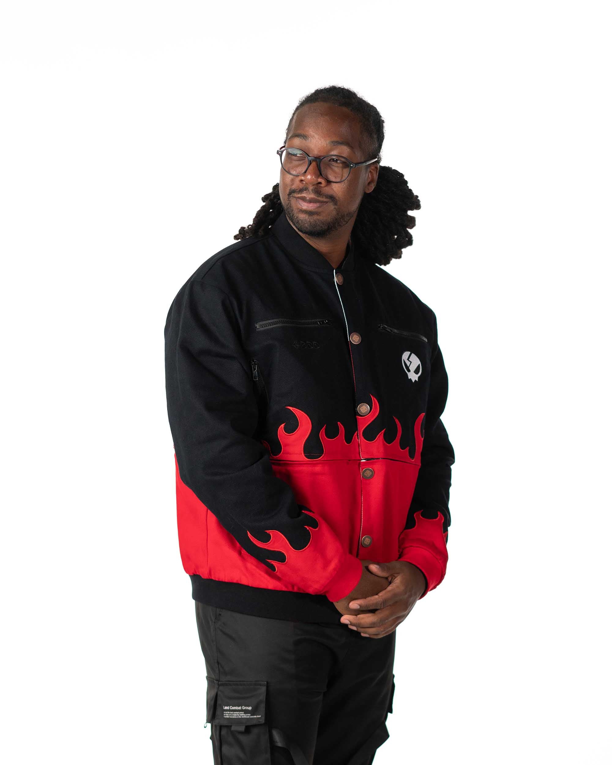 Male model wearing black and red flame Gurren Lagann reversible jacket, front-side view, hands clasped.