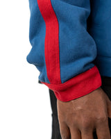 Close-up of the custom heavy-duty denim and red stripe cuff