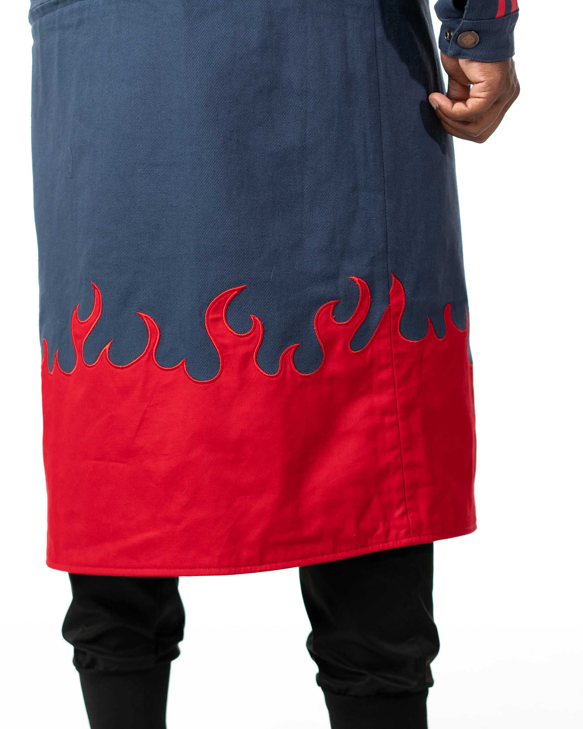 Close up of the bottom of the blue denim long coat highlighting the red flame design and texture