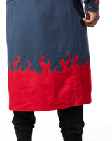 Close up of the bottom of the blue denim long coat highlighting the red flame design and texture