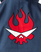 Ultra close up of the high density red flaming skull embroidery on the back of the blue denim side