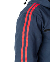 Detailed view of the red stripes printed down the sleeve of the blue denim side of the coat
