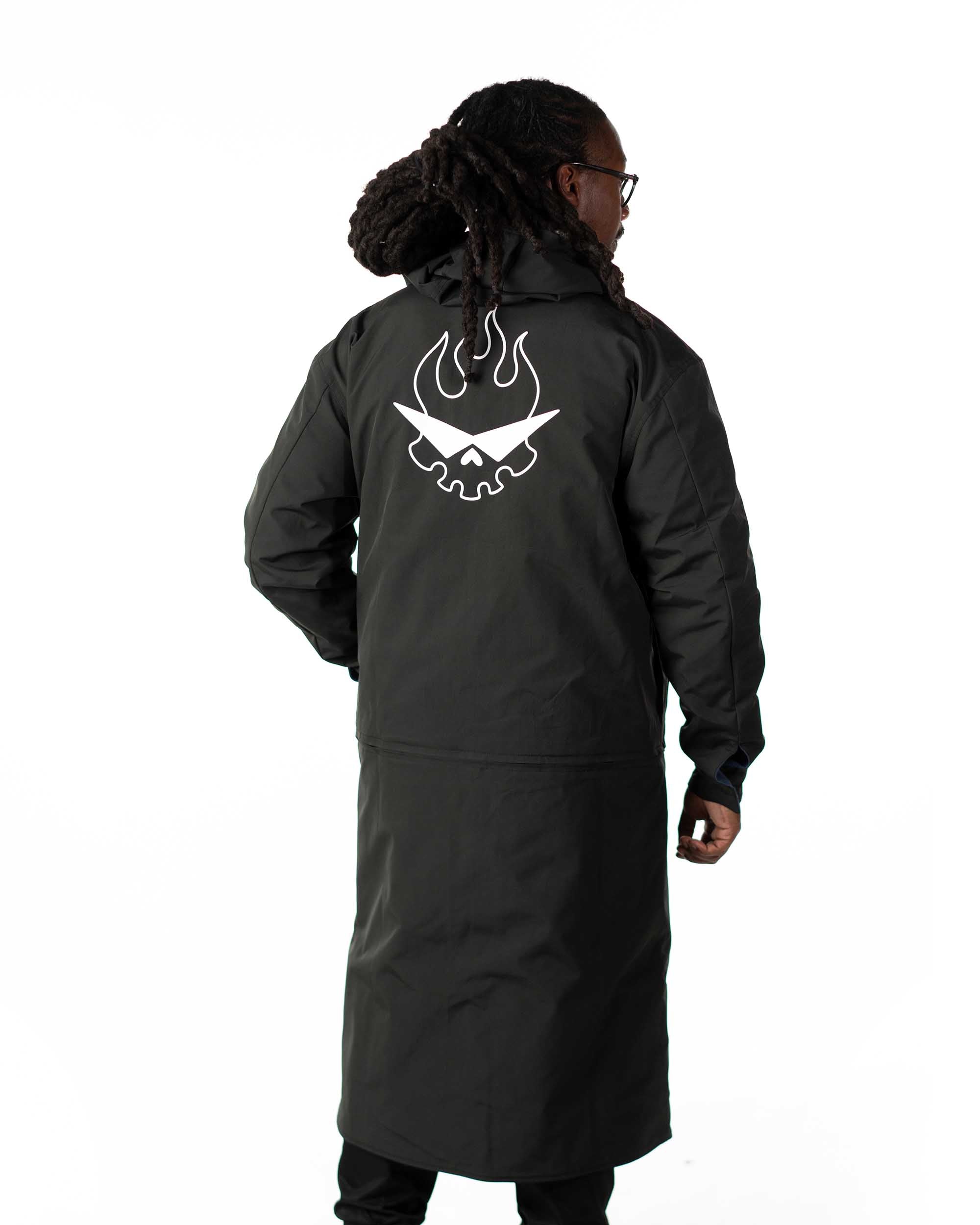 Rear view of the black polyester side of the reversible Simon long coat with white Team Dai Gurren logo