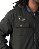 Close up of the front zipper, high collar, and hood on the black polyester windbreaker side of the coat