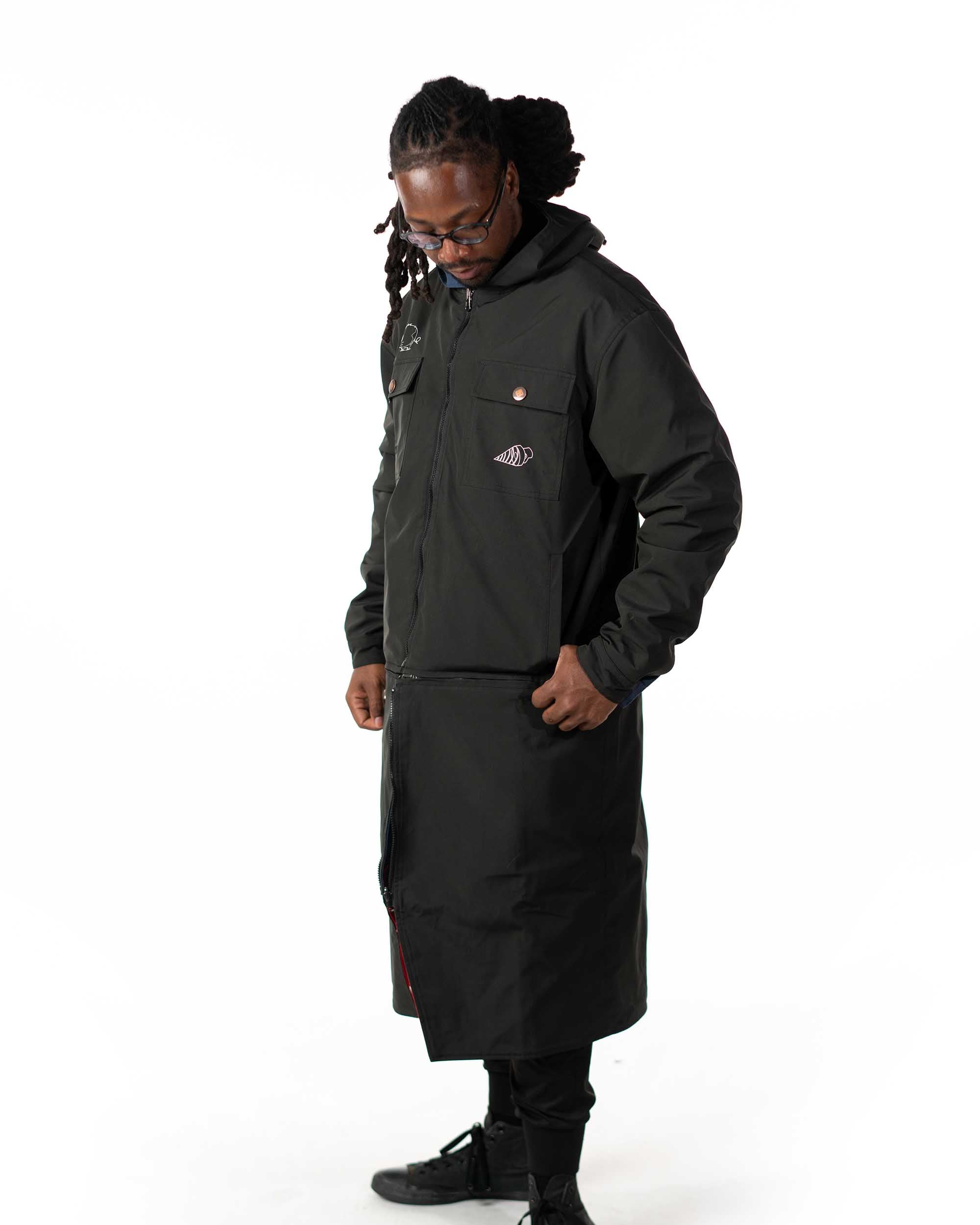 Side profile view of the Simon long coat worn on the black polyester windbreaker side with the hood up