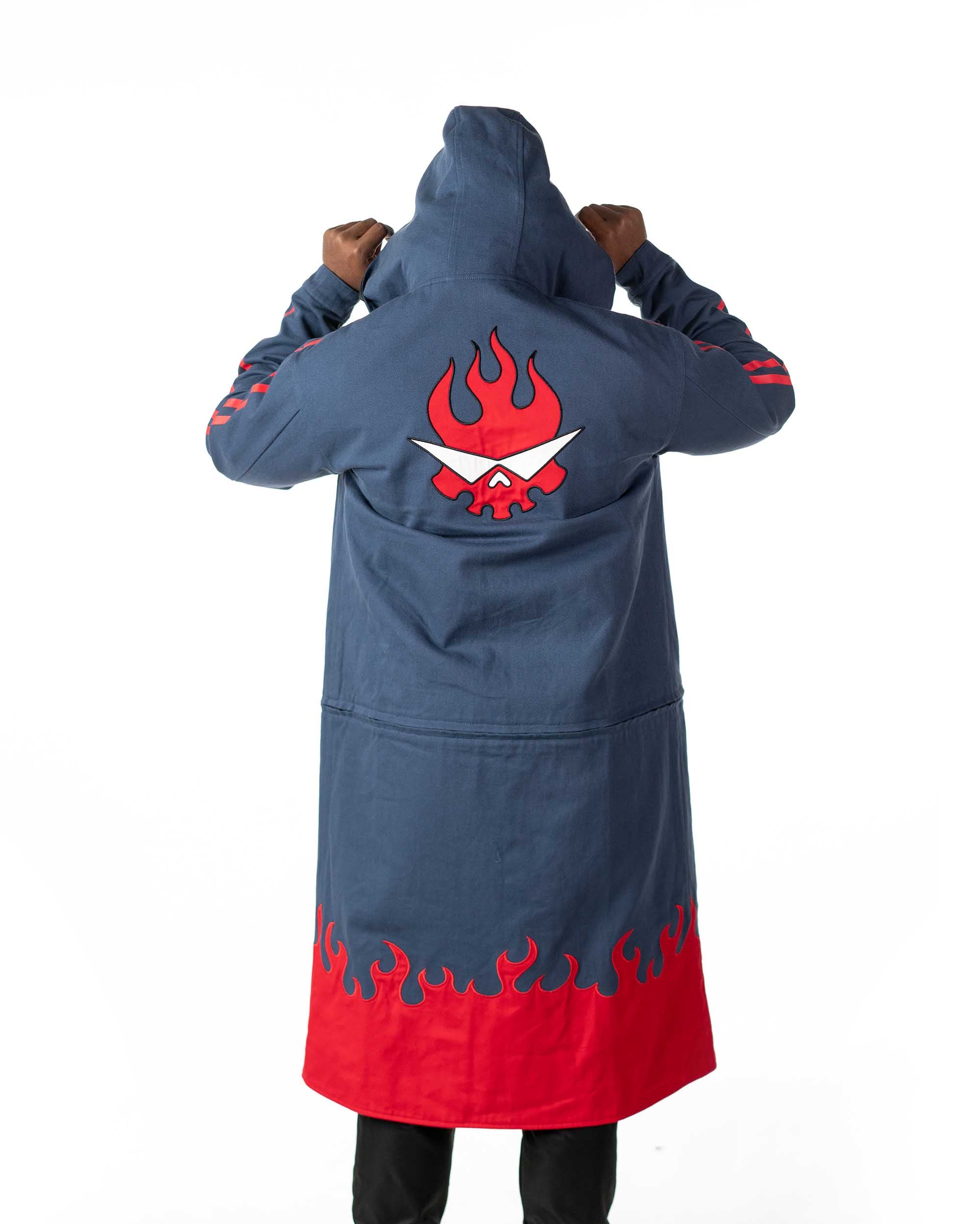 Rear view of the blue denim side of the Gurren Lagann long coat showing red flaming skull embroidery and flame print hem