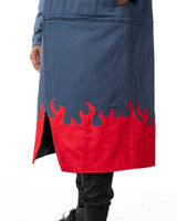 Close up view of the split hem on the blue denim side showing the screen printed red flame pattern