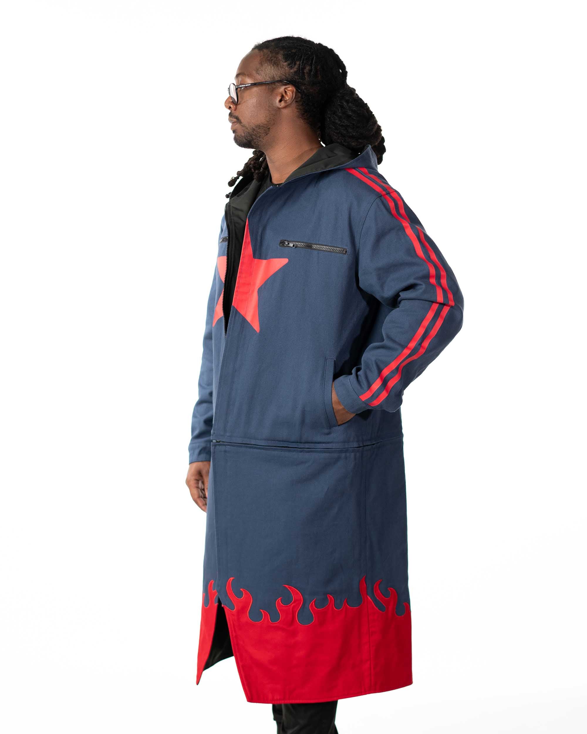 Full length profile shot of the model wearing the blue denim side of the long coat