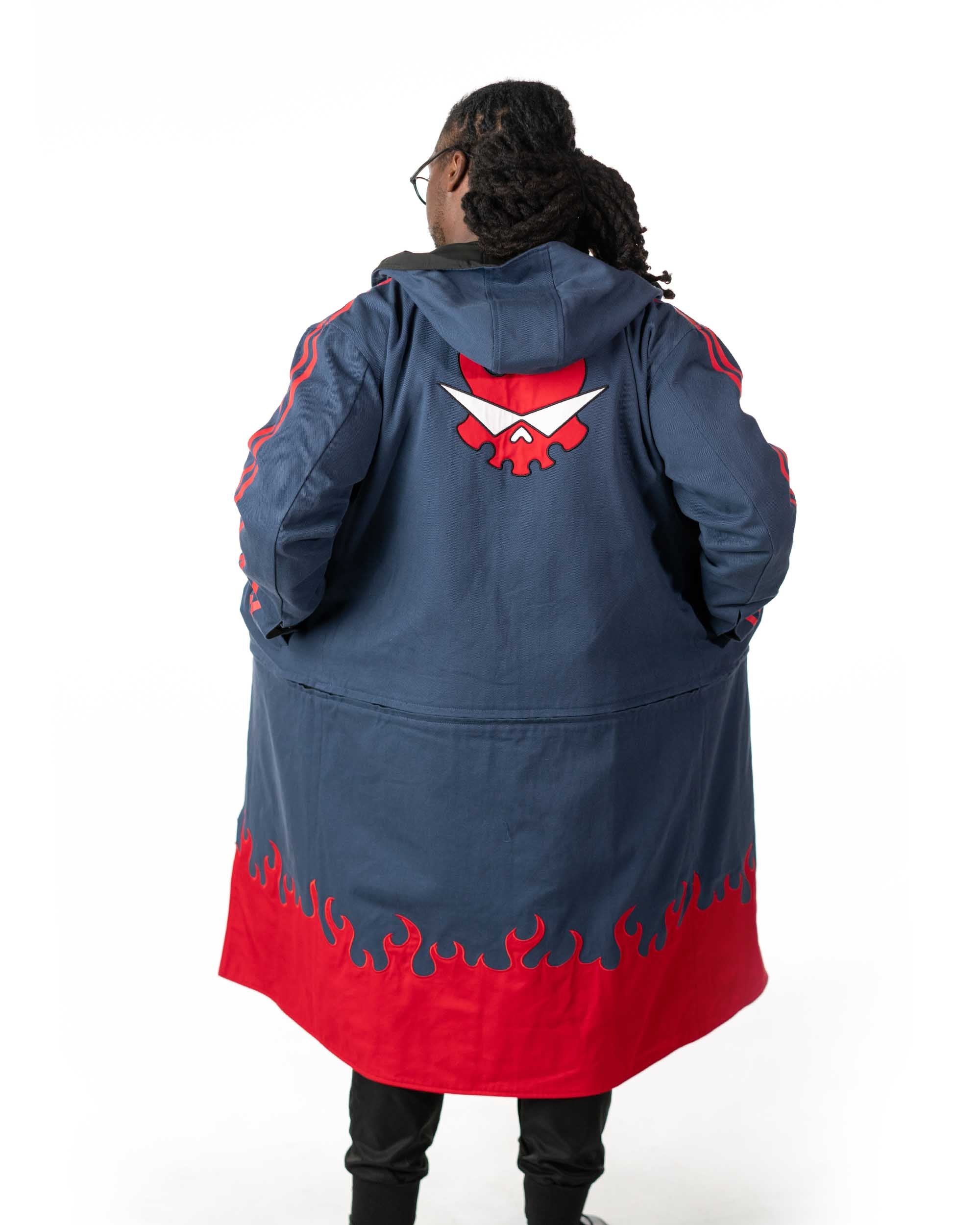 Back angle of the full length blue denim coat showing the large red flaming skull back graphic
