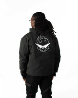 Back view of the model wearing the converted short coat version on the black polyester side