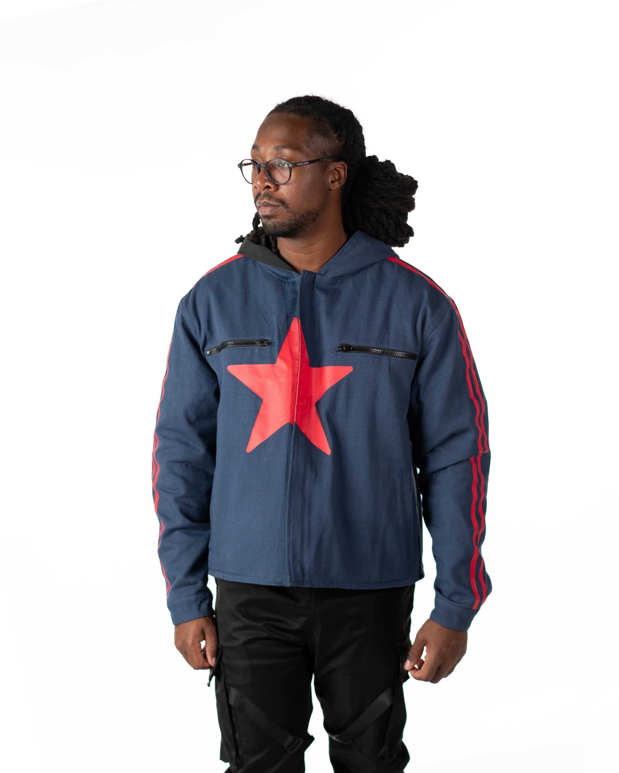 Front view of model in the short coat version on the blue denim side with the red star chest print