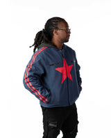 Side profile of the blue denim short coat version highlighting the red stripes printed down the sleeve
