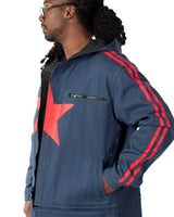 Mid shot profile of the model wearing the converted short coat version of the blue denim side