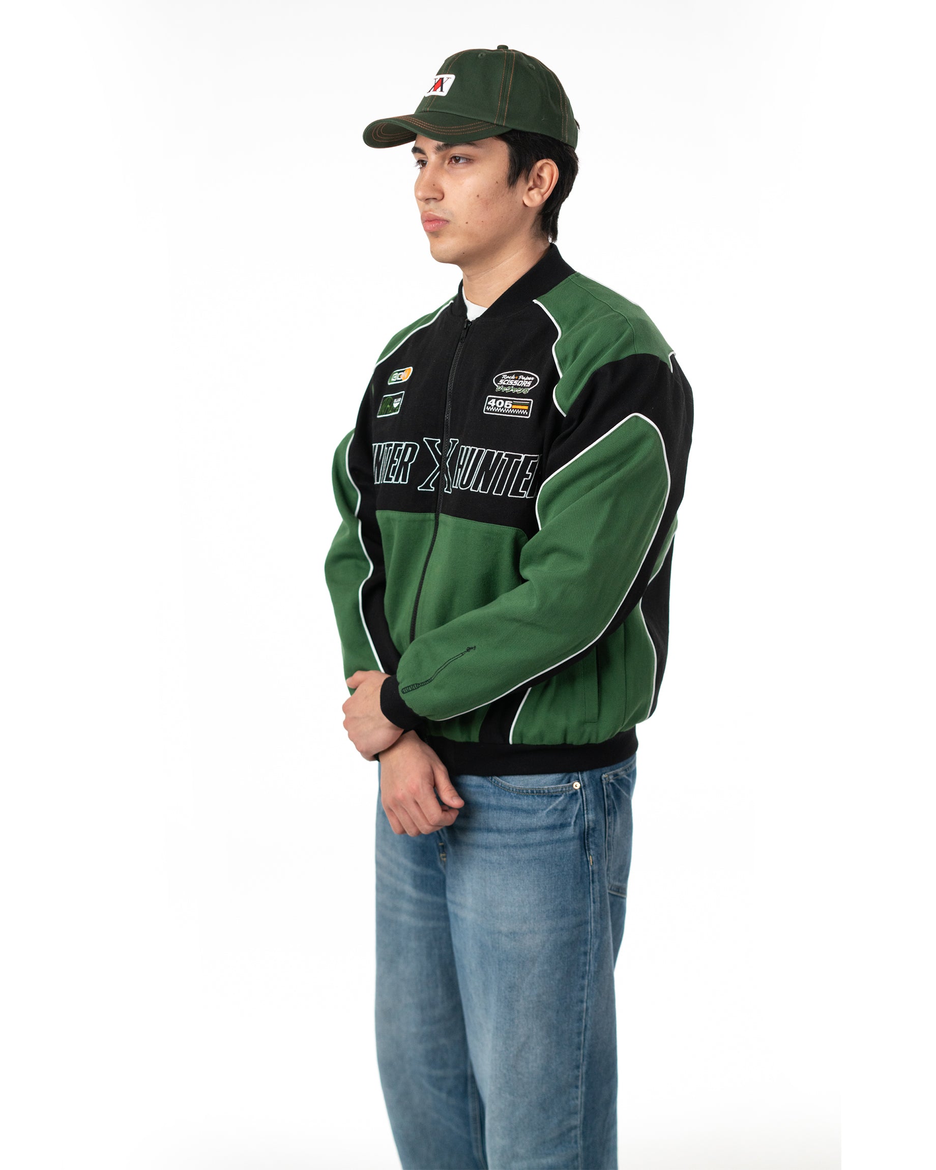 Three quarter front view of male model standing in the officially licensed Gon racing jacket