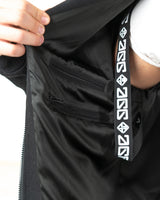 Close up of the inner lining of the Gon racing jacket showing the repeating brand design shoulder strap on the interior lining