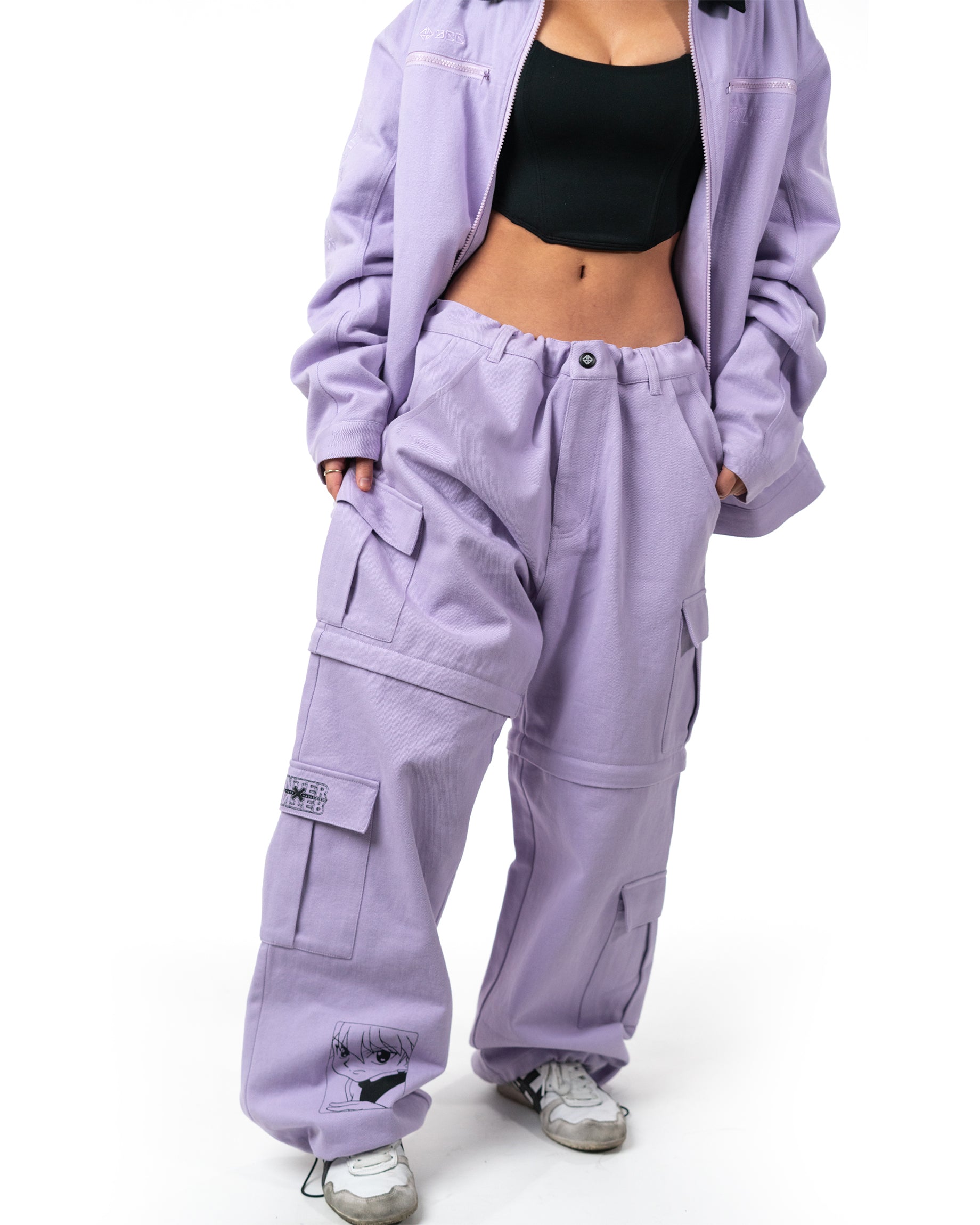 Model standing full length wearing the oversized lavender Killua cargo pants