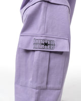 Detailed shot of the cargo pants pocket with the embroidered Hunter x Hunter license patch