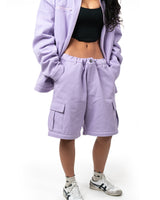 Model wearing matching lavender jacket and the zipped off Killua cargo shorts version of the pants