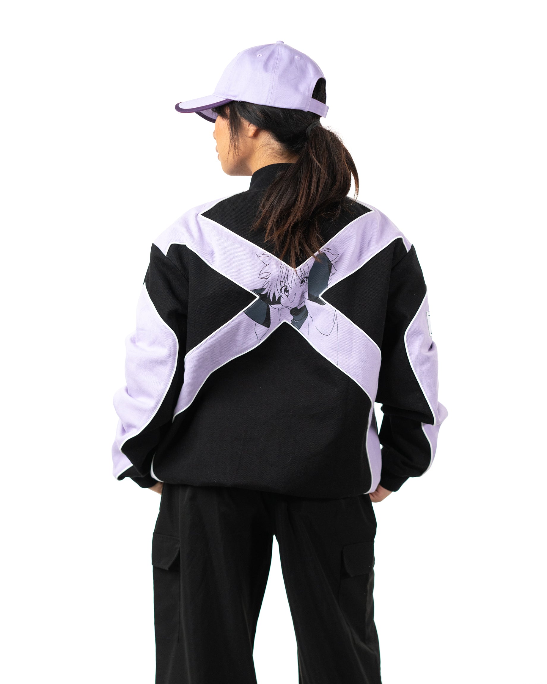 Back view of female model wearing the officially licensed Killua racing jacket with lavender X graphic
