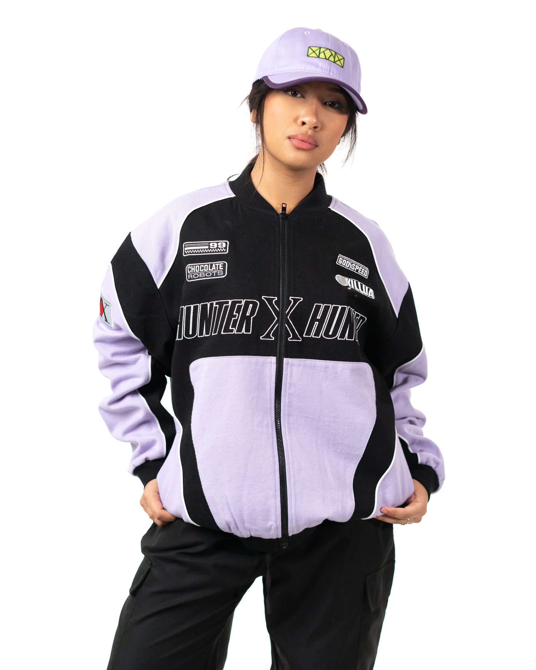 Full front view of female model standing in the officially licensed Killua racing jacket with matching cap