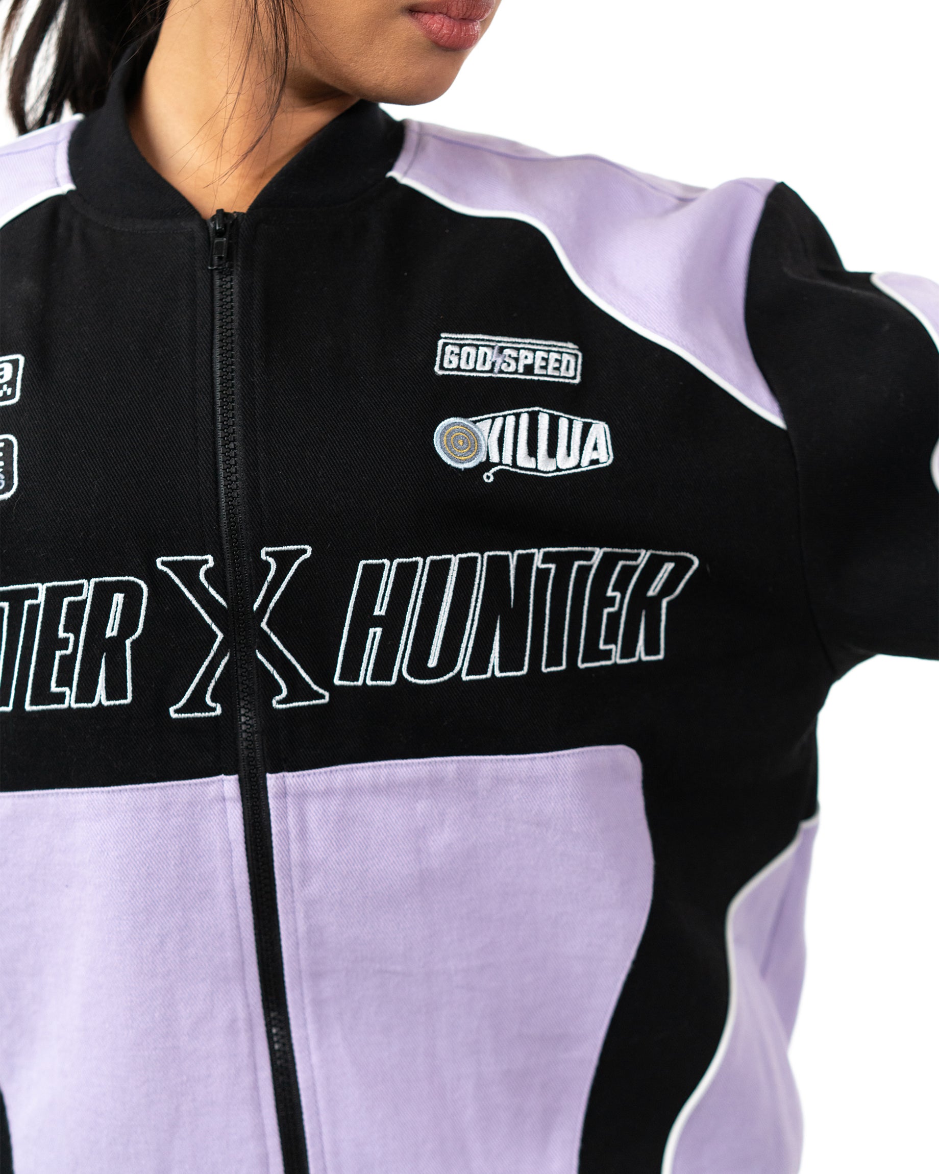 Close up of the left chest on the Killua racing jacket showing the embroidered Godspeed patch