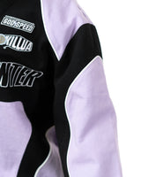 Side profile of the Killua racing jacket sleeve highlighting the Godspeed and Killua embroidered patches
