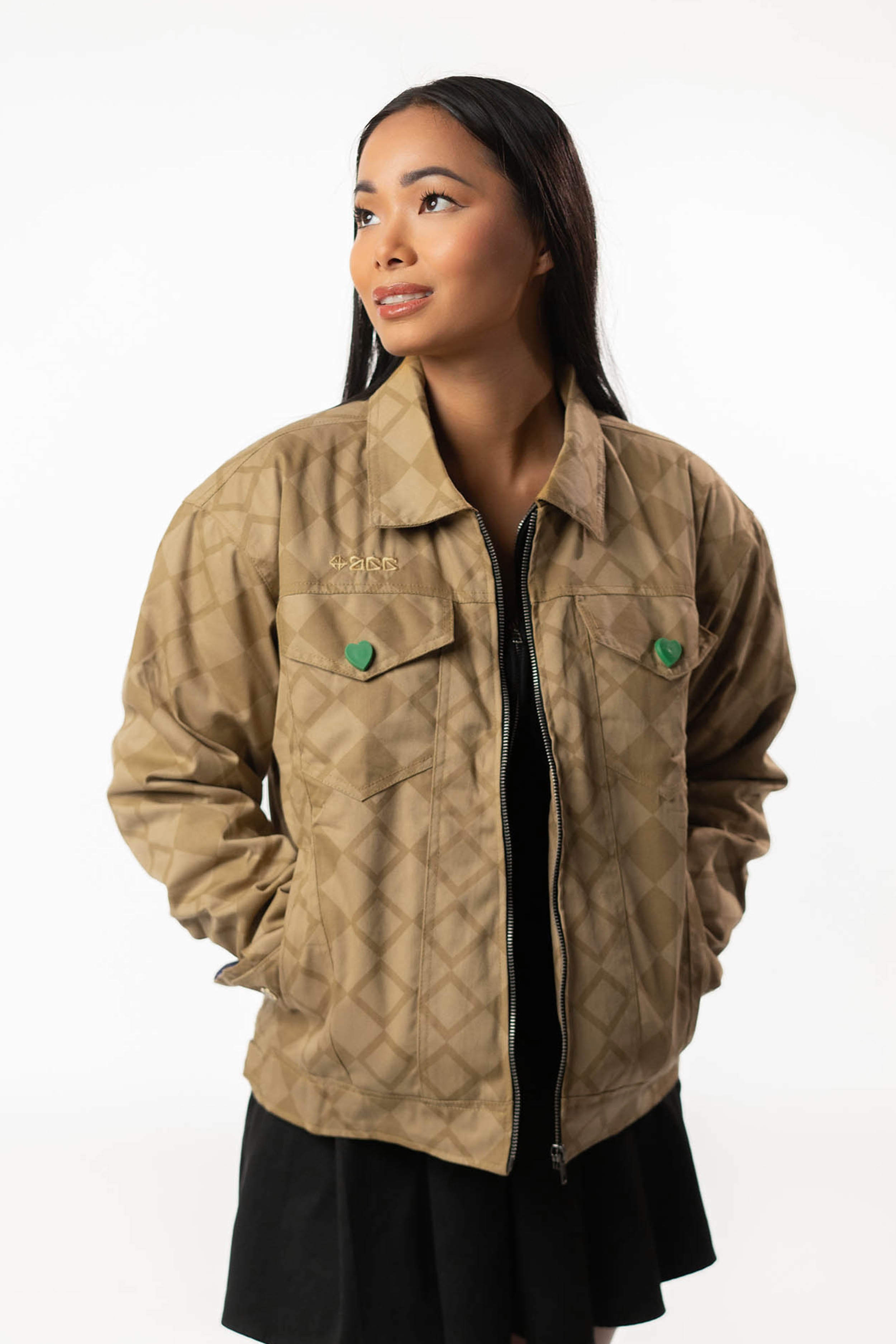 Front view of the gold DIO jacket on a female model.