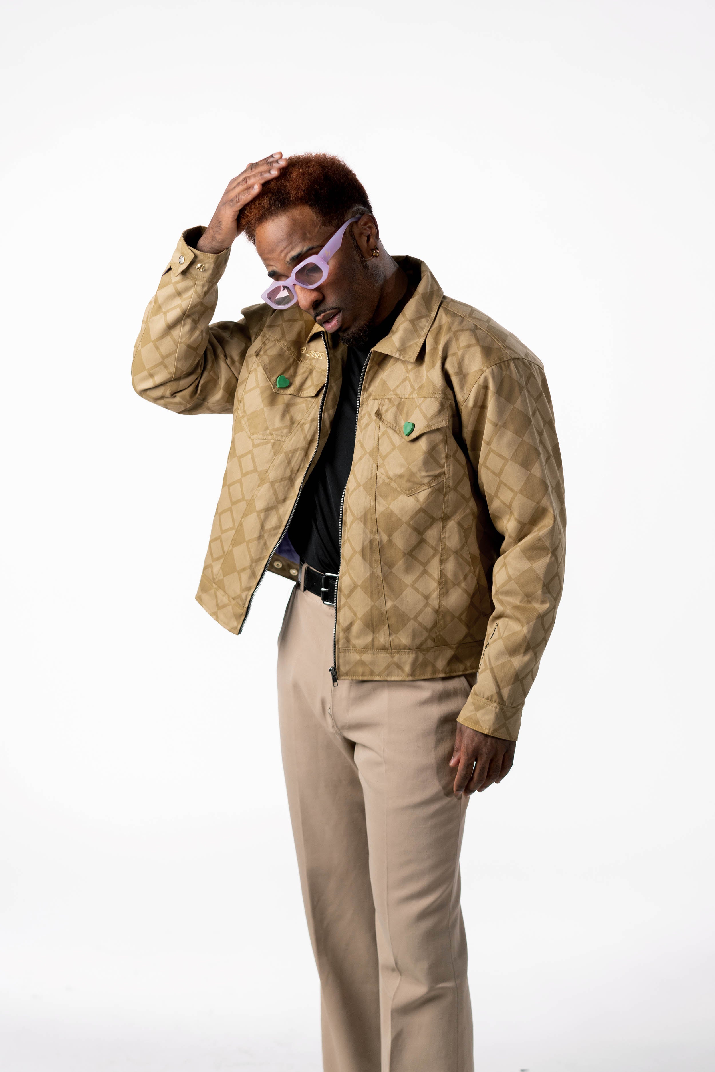 Front view of the gold diamond-patterned DIO jacket on a male model.