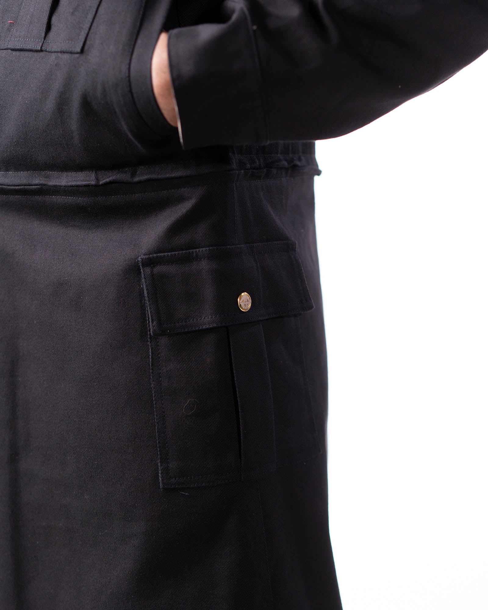 Side view showing the deep utility waist pocket on the black side.
