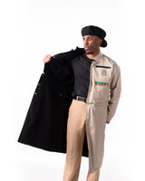 Model pulling open the beige side to display the black reversible interior lining.