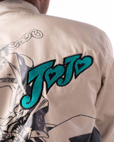 Close-up of the teal JoJo embroidery on the beige side of the reversible coat.