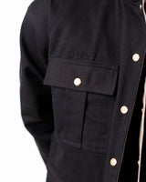 Detailed close-up of the chest pocket and cuff construction on the black side.