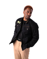 Front view of the Jotaro Kujo black jacket on a male model.