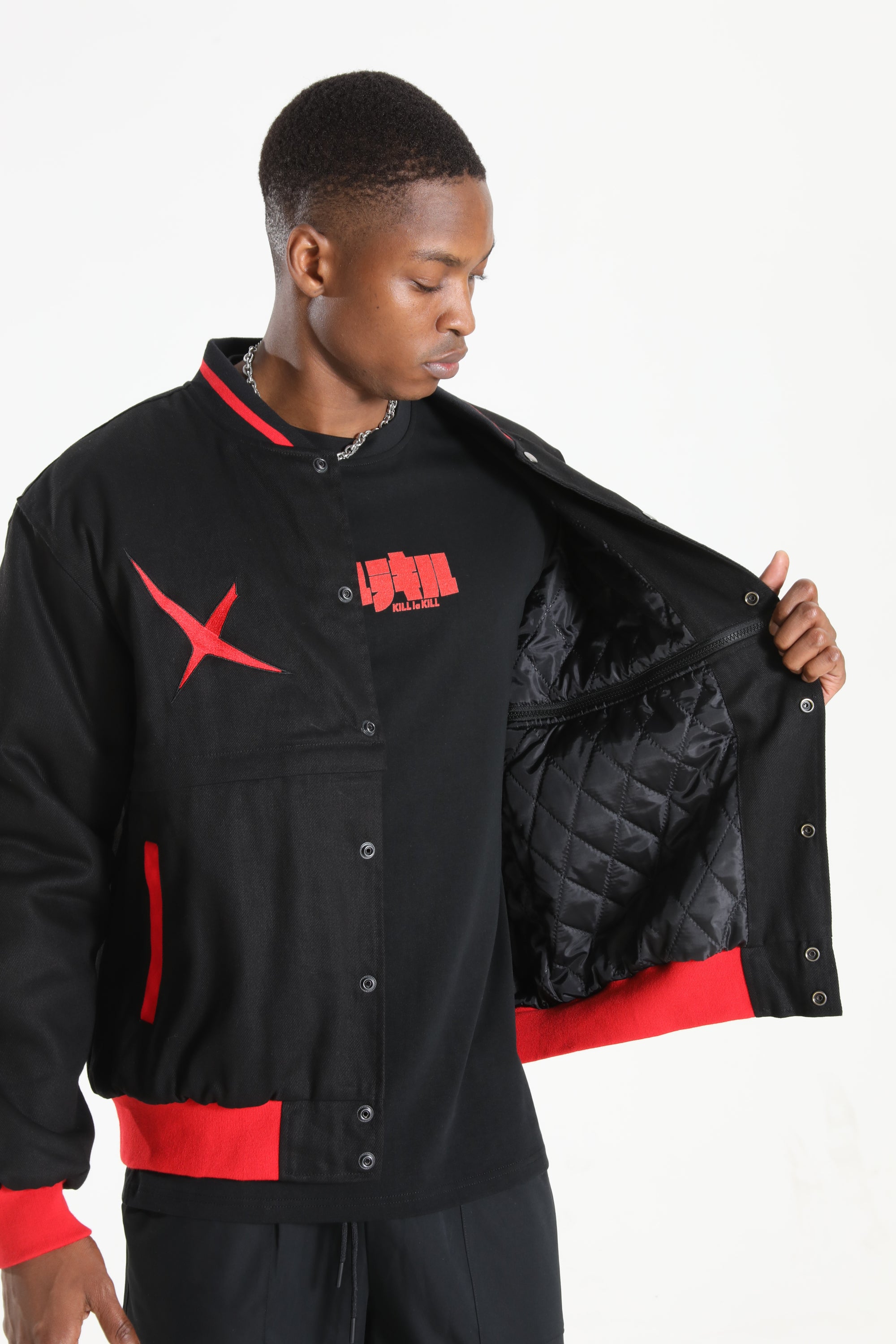 Detailed view of the inner red quilted texture and the jacket's interior finish.