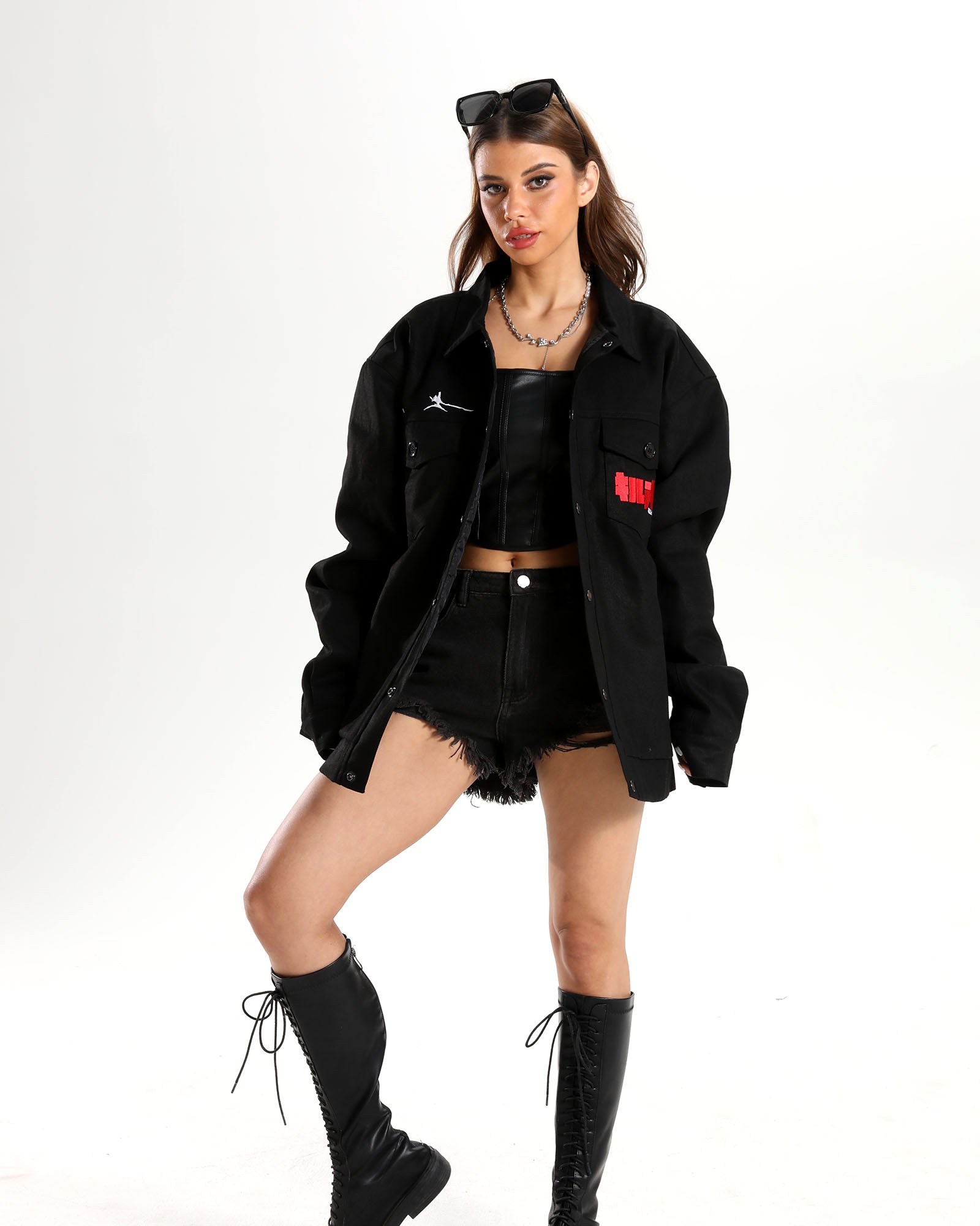 Front view of the black Ryuko Silhouette Denim Jacket on a female model.