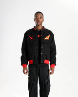 Front view of the black Senketsu Short Denim Jacket on a male model.