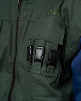 Naruto Shippuden Jonin Jacket chest detail with subtle Anime Gear Guru embroidery, black buckles and green tactical pocket