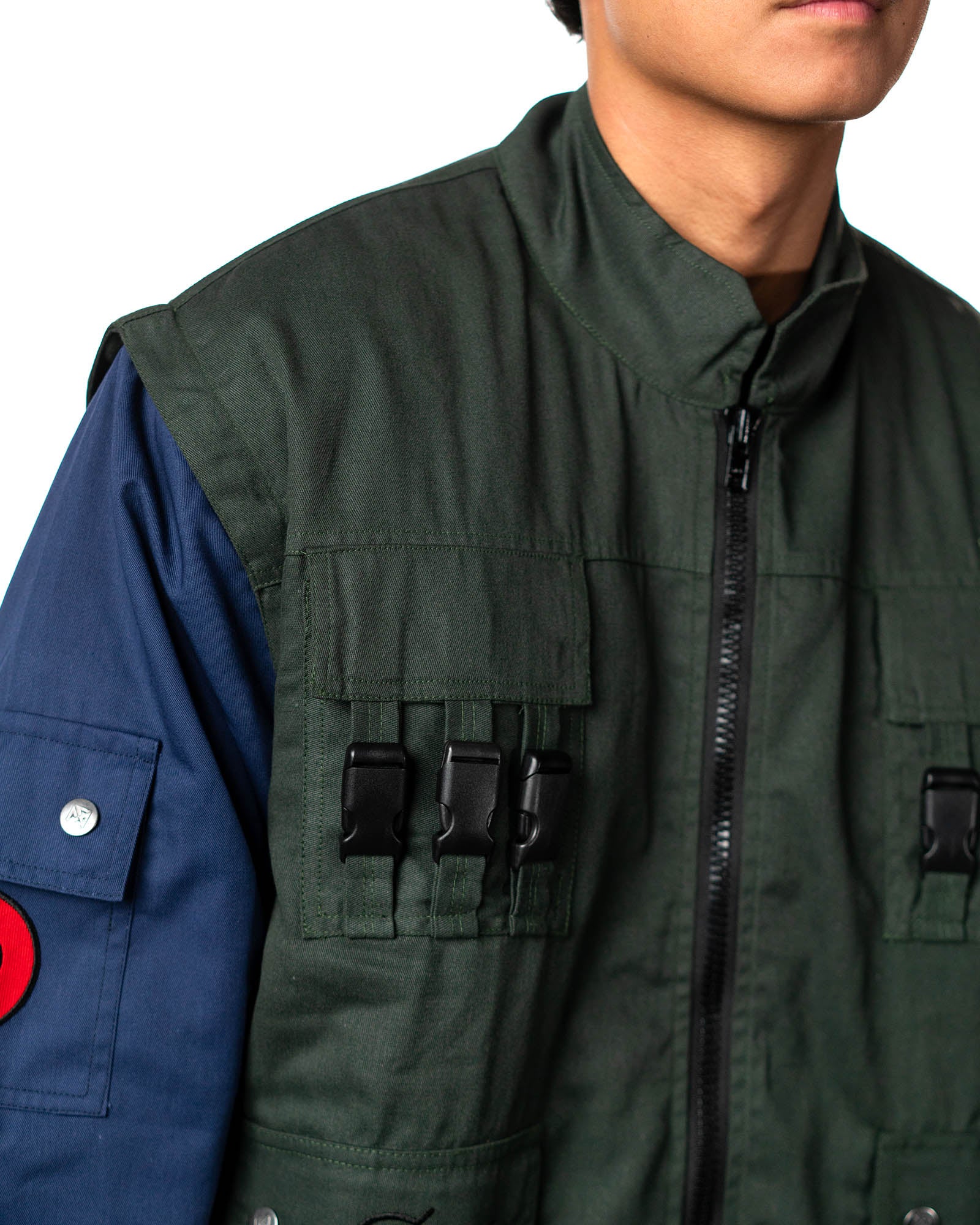 Close-up of the Naruto Shippuden Jonin Jacket collar, front zipper, chest utility pocket and black buckle hardware