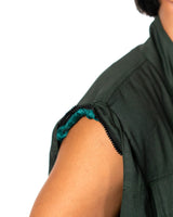 Close-up of the Naruto Shippuden Jonin Jacket sleeveless arm opening with hidden zipper track for removable sleeves